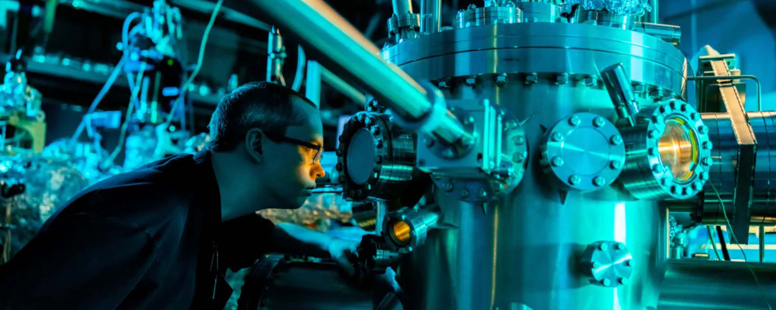 A graduate student works in the Molecular Beam Epitaxy Core Facility